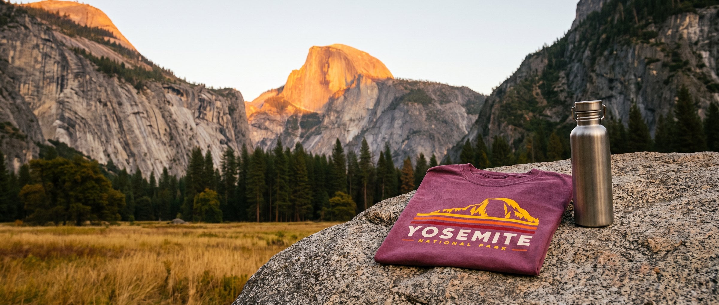 Folded Yosemite National Park tee on a granite rock in Yosemite Valley with Half Dome at golden hour